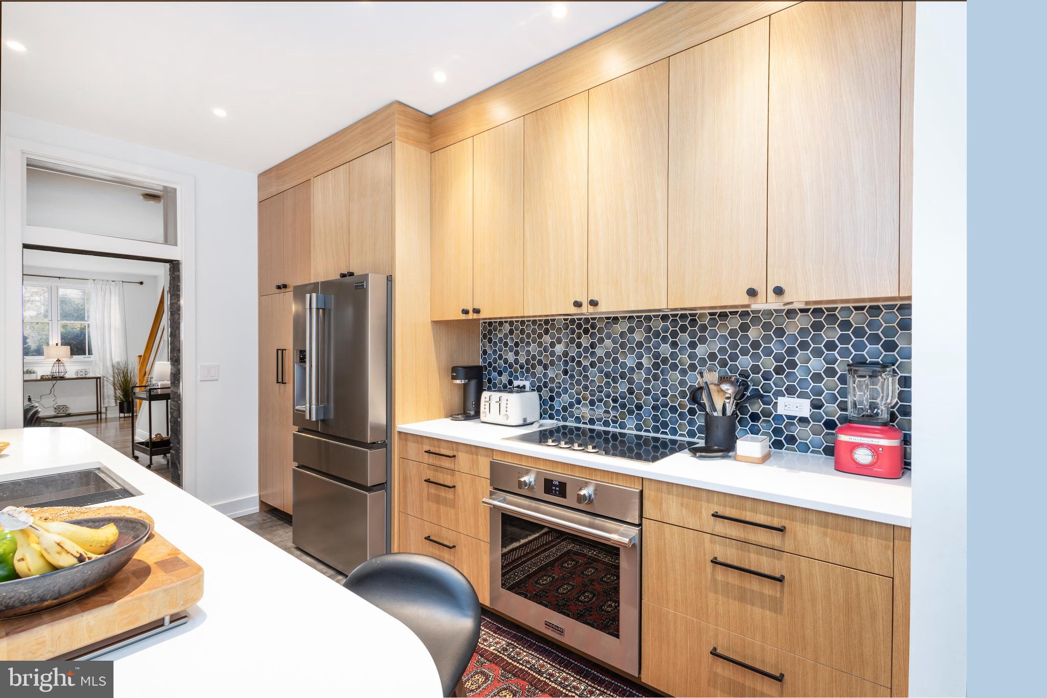 929 South 6th Street Philadelphia, PA 19147 - Photo 7 of 28 a kitchen with stainless steel appliances a stove a sink and cabinets