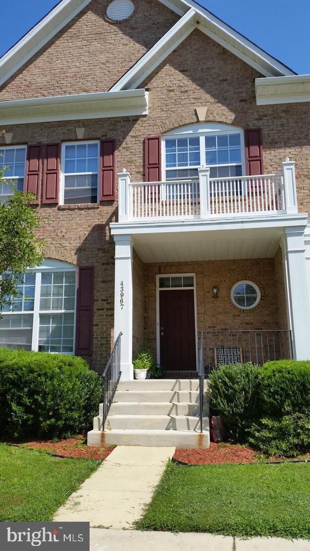 43967 Peony Place California, MD 20619 - Photo 1 of 27 a front view of a house with a porch