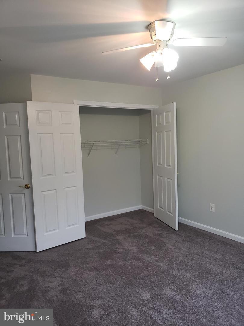 43967 Peony Place California, MD 20619 - Photo 17 of 27 a view of an empty room with a ceiling fan