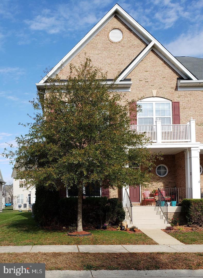 43967 Peony Place California, MD 20619 - Photo 2 of 27 a front view of a house with a yard