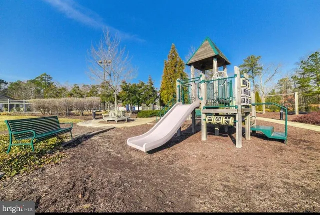 a view of a house with backyard porch and sitting area