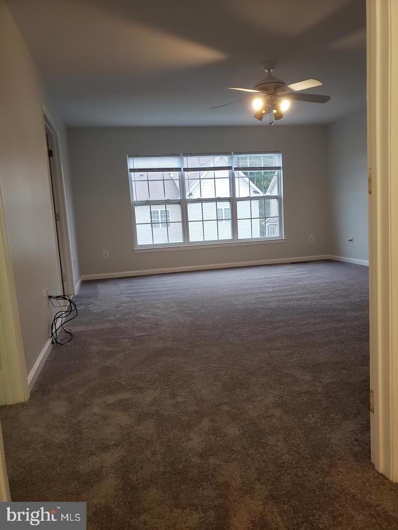 43967 Peony Place California, MD 20619 - Photo 25 of 27 an empty room with a empty space and windows