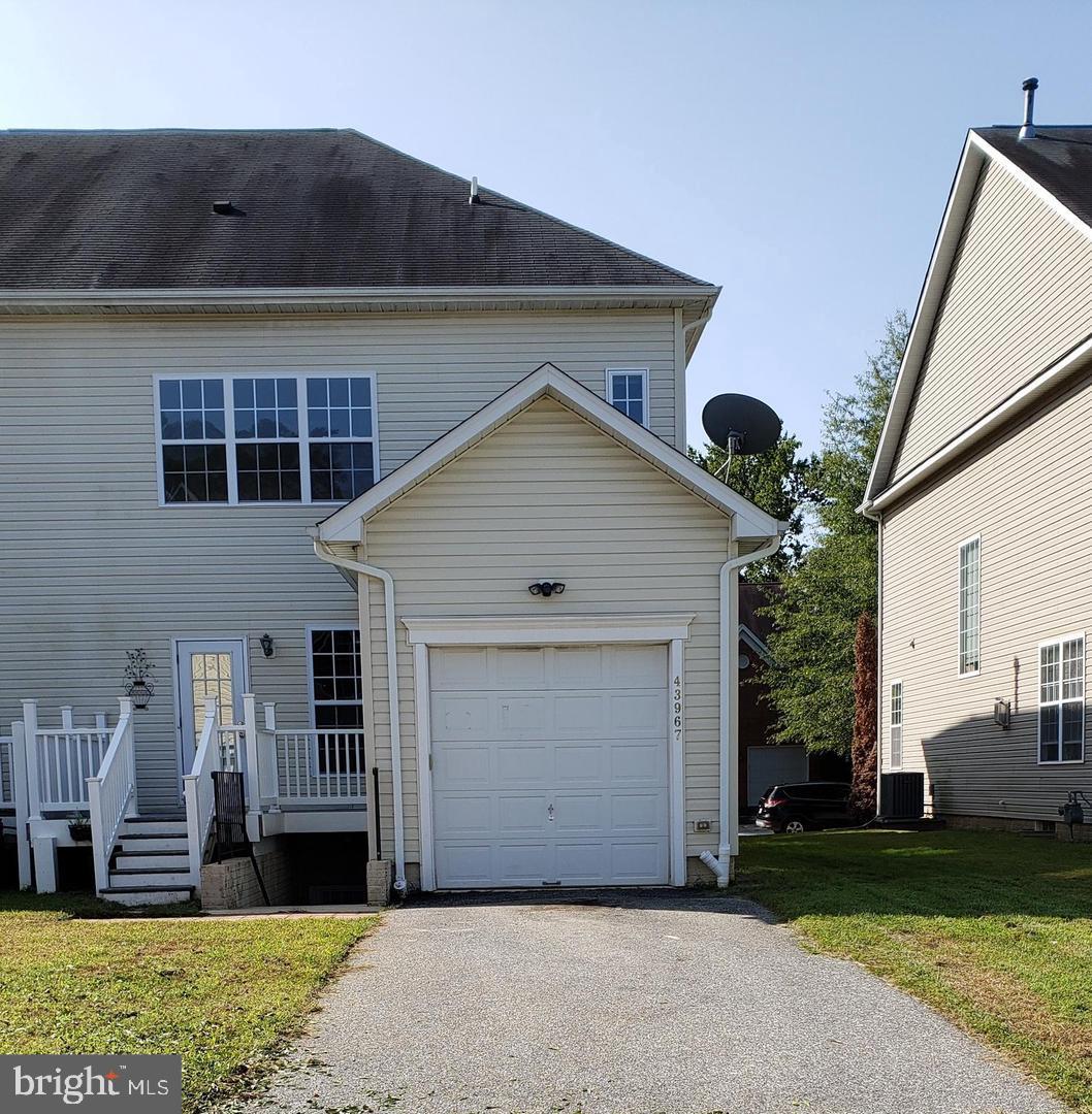 43967 Peony Place California, MD 20619 - Photo 26 of 27 a front view of a house with a yard
