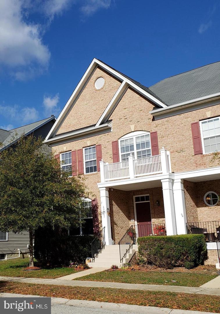 43967 Peony Place California, MD 20619 - Photo 3 of 27 a front view of a house with a yard
