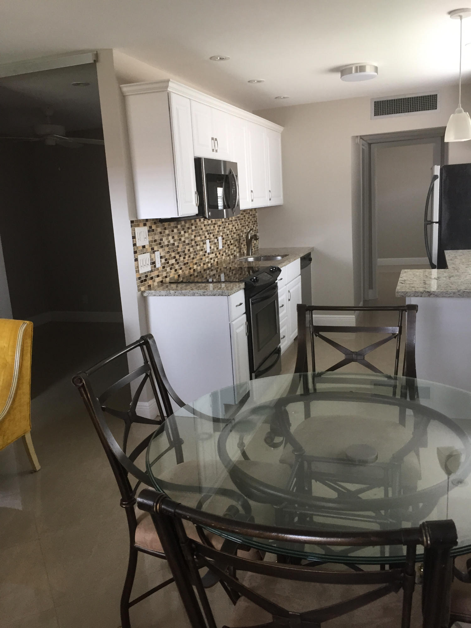 611 Monaco Way, Unit 611 Delray Beach, FL 33446 - Photo 9 of 25 Dining Room Kitchen