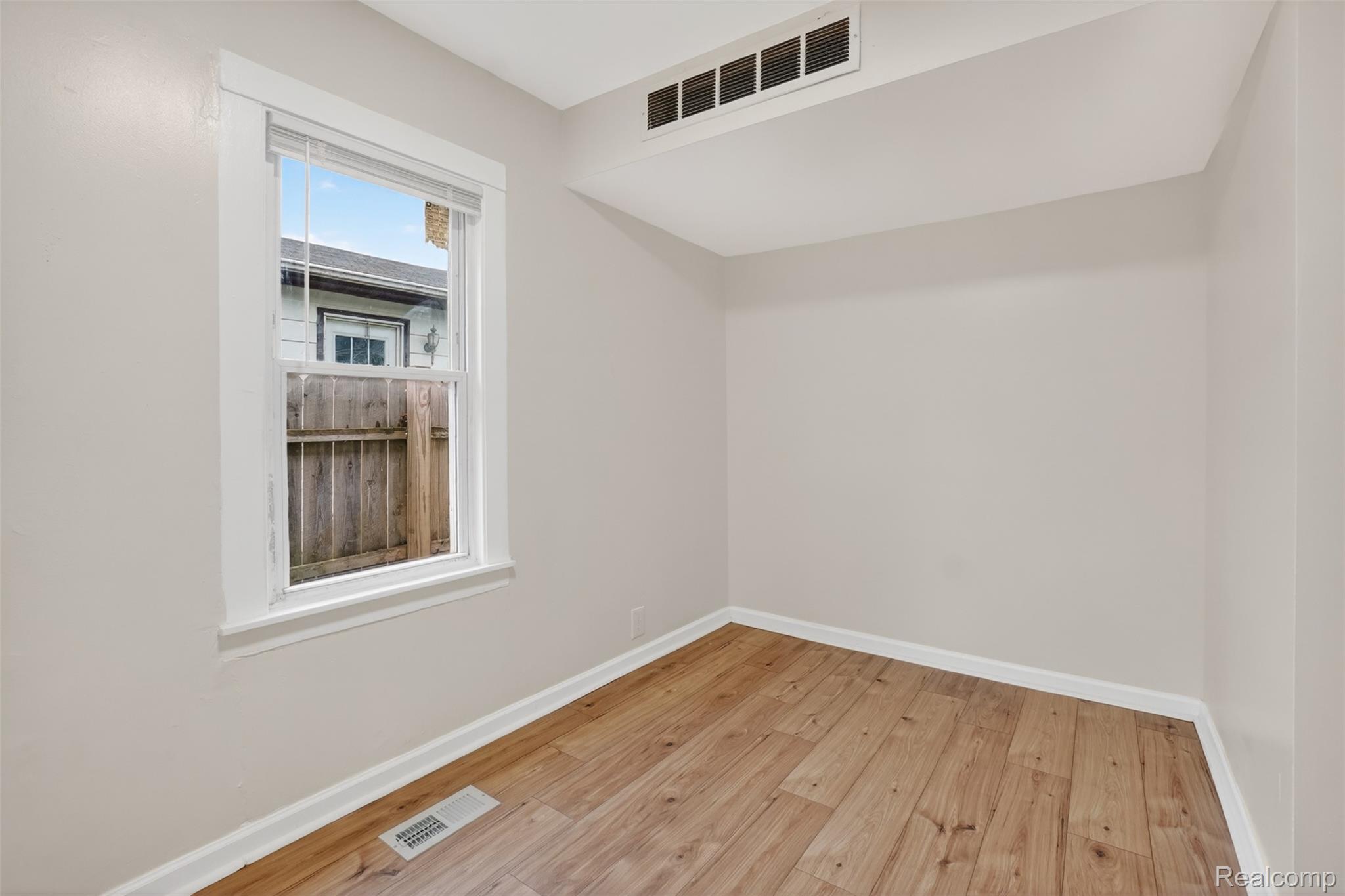 4910 Hughes Road Lansing, MI 48910 - Photo 19 of 27 Bonus room with baseboards and light wood-style flooring