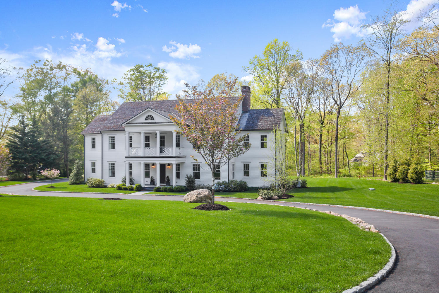 44 Allwood Road Darien, CT 06820 - Photo 1 of 1 a front view of a house with garden and trees