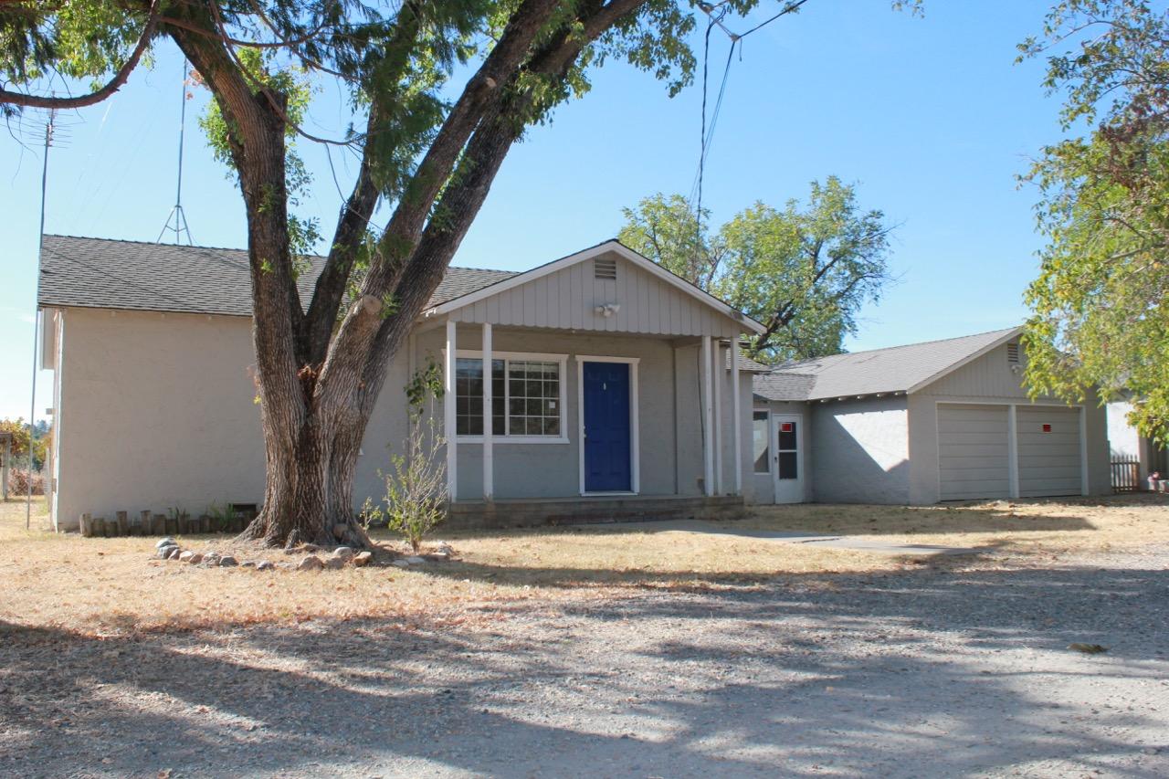 19819 Reeds Creek Road Red Bluff, CA 96080 - Photo 1 of 18 a front view of a house with a yard and garage