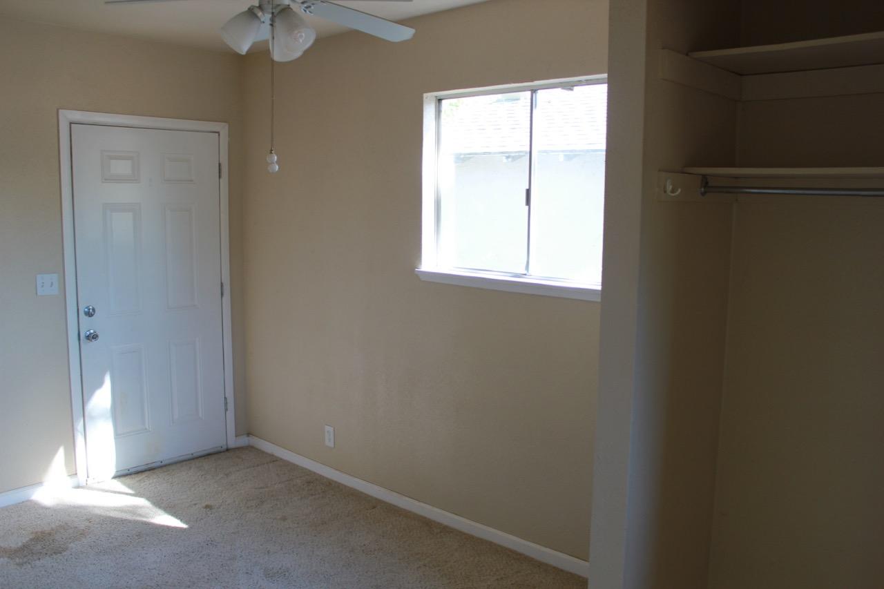 19819 Reeds Creek Road Red Bluff, CA 96080 - Photo 13 of 18 an empty room with a window