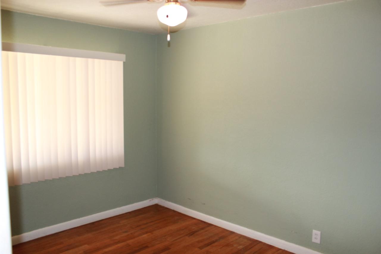 19819 Reeds Creek Road Red Bluff, CA 96080 - Photo 8 of 18 a view of a small space with wooden floor and a window