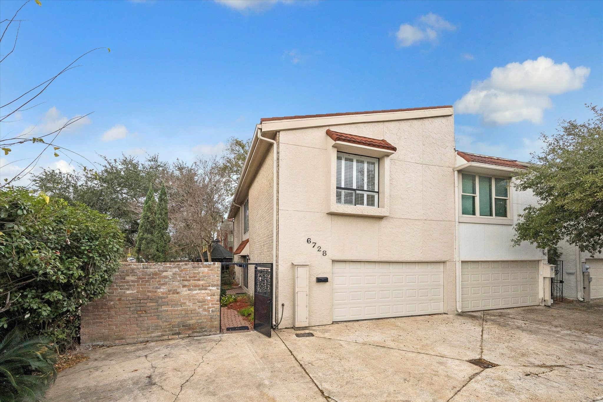 a view of a white house with a outdoor space