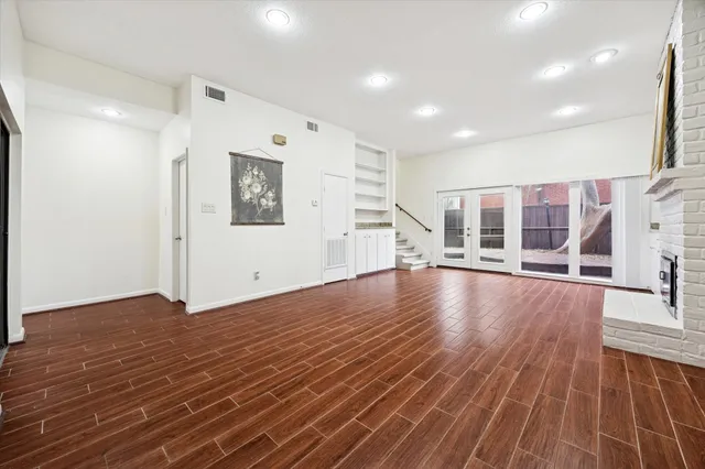 a view of a livingroom with wooden floor