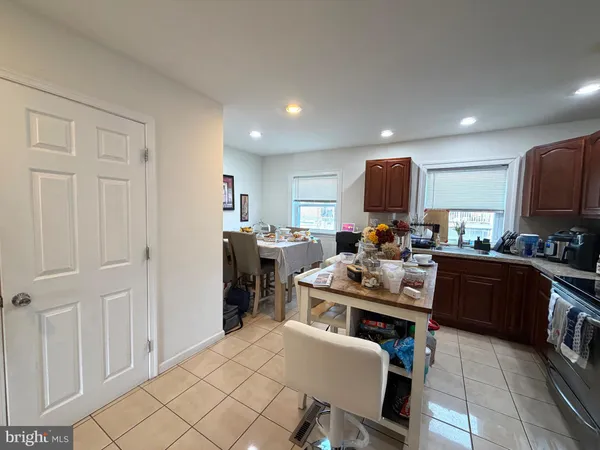 a kitchen with a table and chairs in it