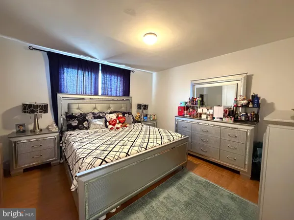 a bed room with a bed and a dresser
