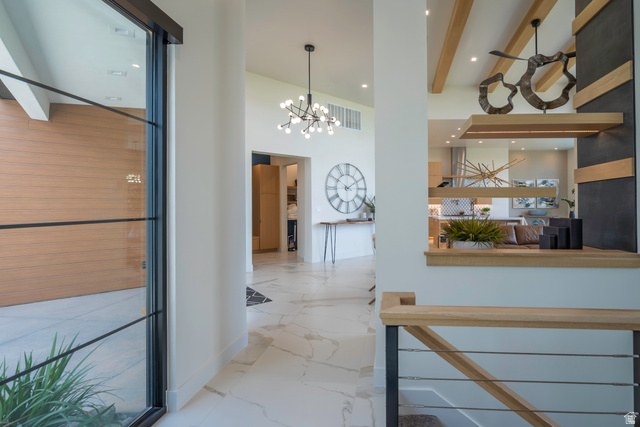 3606 South Cypress Road Hurricane, UT 84737 - Photo 42 of 69 Hall with a chandelier and baseboards