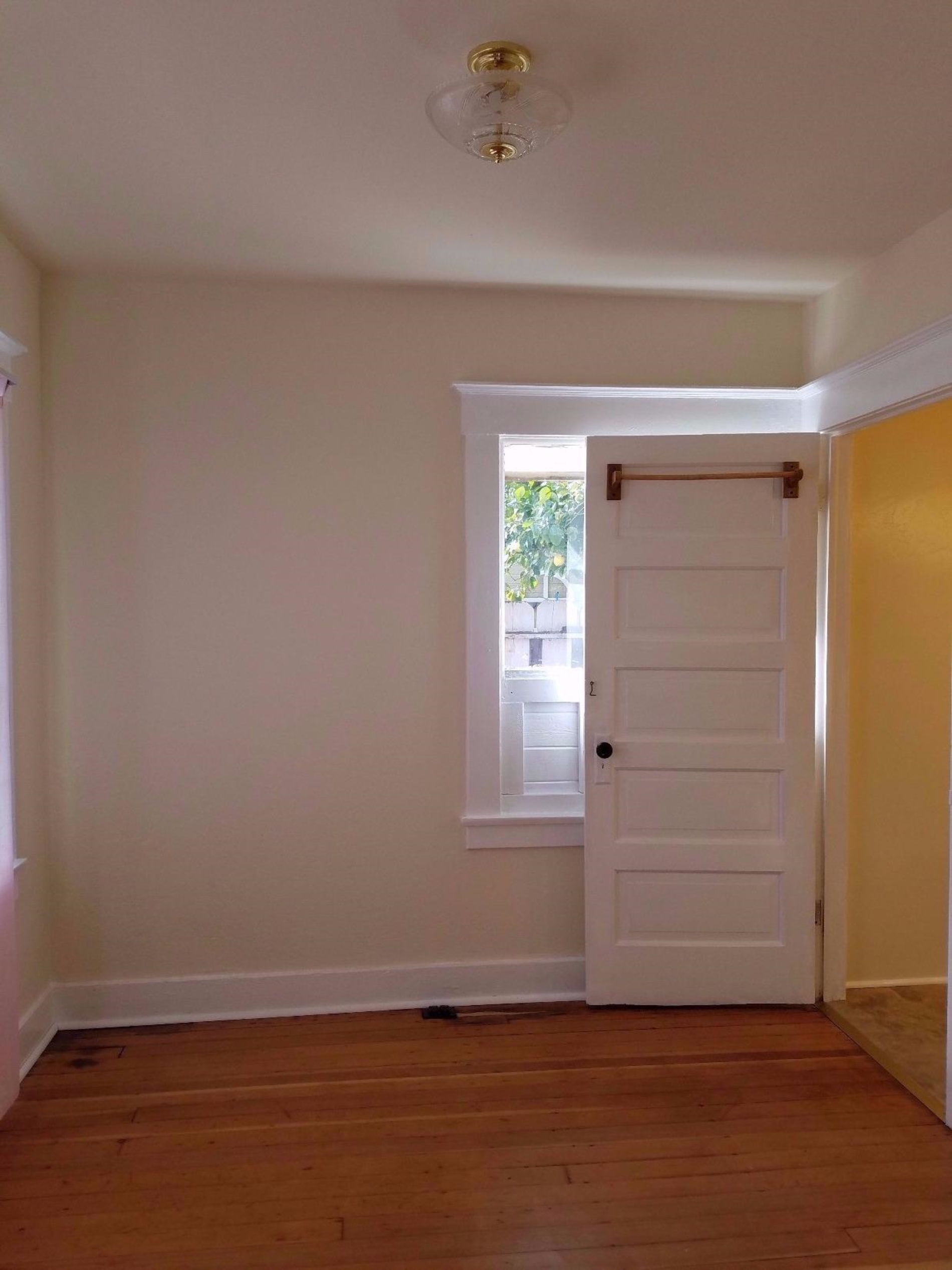 1455 10th Street Reedley, CA 93654 - Photo 5 of 9 wooden floor in an empty room