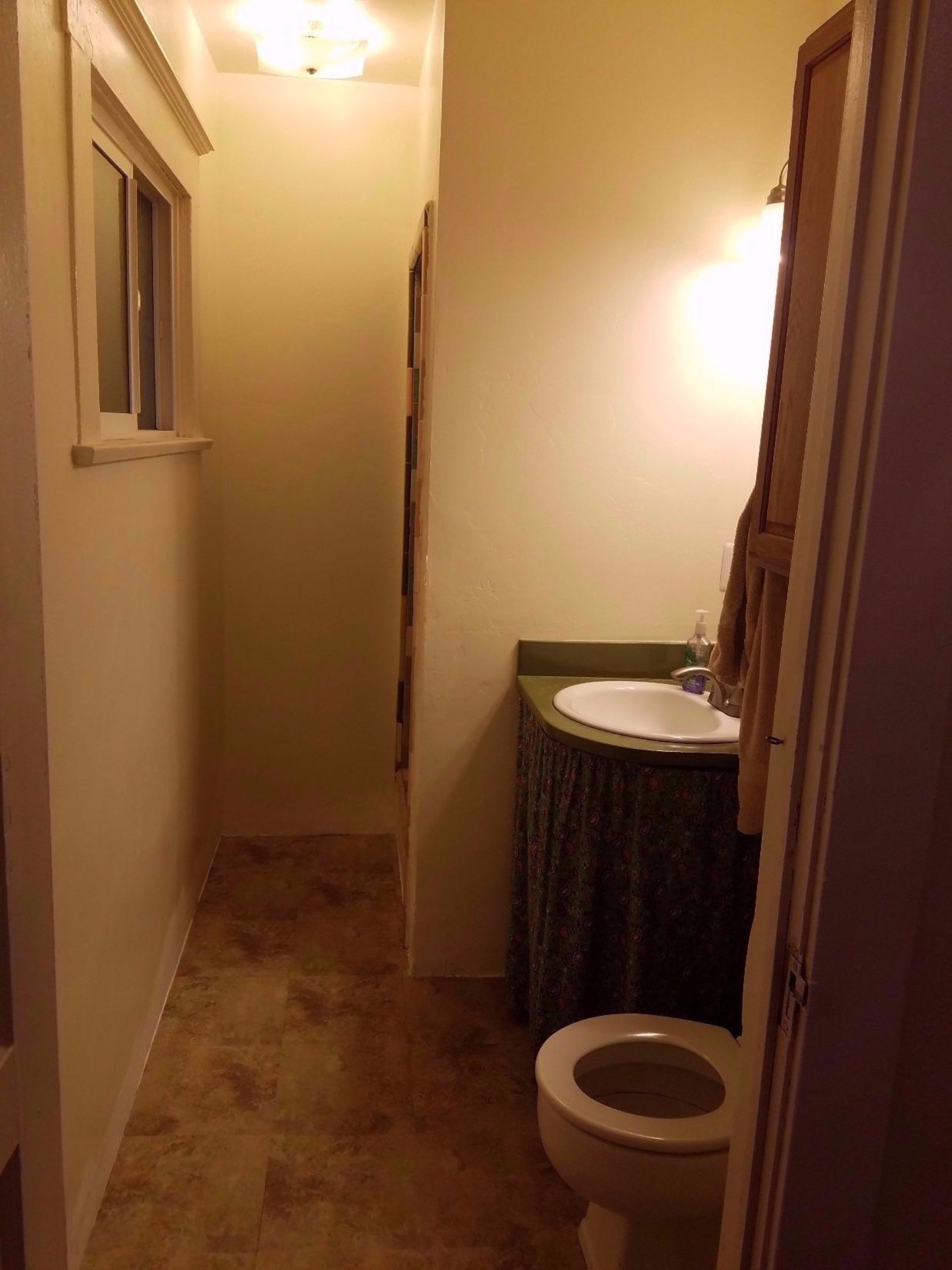 1455 10th Street Reedley, CA 93654 - Photo 7 of 9 a bathroom with a sink and toilet