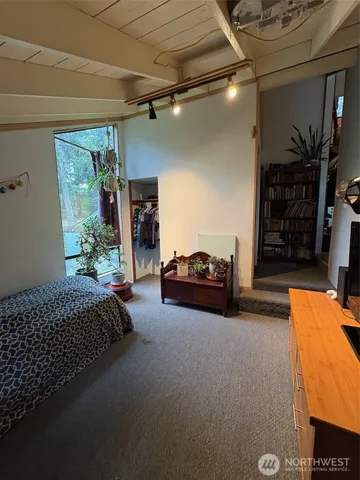 a bed room with a bed and a couch