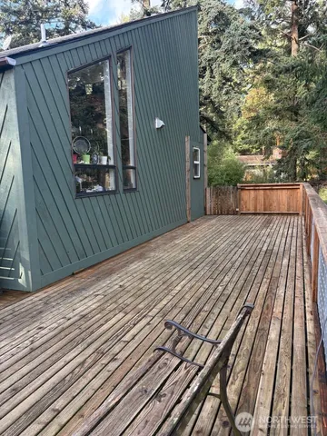 a view of backyard with small cabin