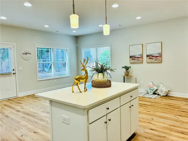 a kitchen with a sink cabinets and window