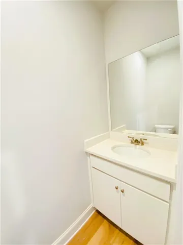 a bathroom with a sink and vanity
