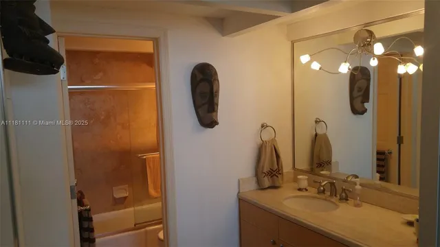 a bathroom with a sink vanity and a mirror
