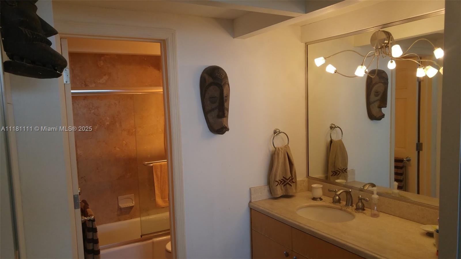 100 Lincoln Road, Unit 1642 Miami Beach, FL 33139 - Photo 15 of 56 a bathroom with a sink vanity and a mirror