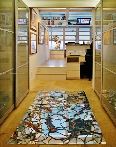 a bathroom with a granite countertop sink a toilet and a mirror