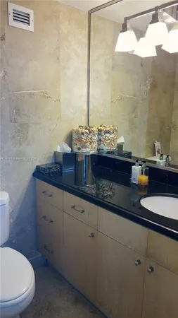 a bathroom with a shower and a sink