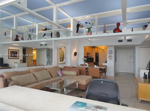 100 Lincoln Road, Unit 1642 Miami Beach, FL 33139 - Photo 10 of 56 a living room with furniture and a fireplace