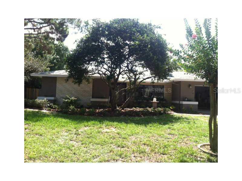 6343 Rockingtree Lane Orlando, FL 32819 - Photo 1 of 1 a view of a backyard with plants and a garden