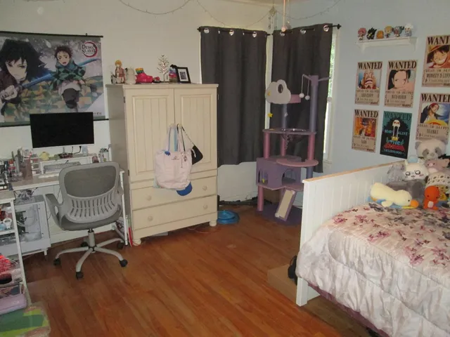 a bedroom with furniture and a bed