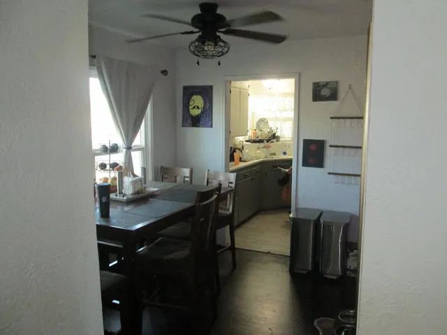 a kitchen with stainless steel appliances granite countertop a sink refrigerator and microwave