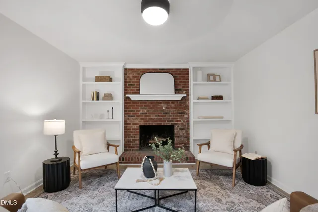 an empty room with a ceiling fan and window