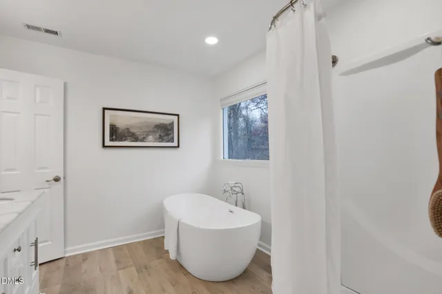 a view of a backyard with large trees