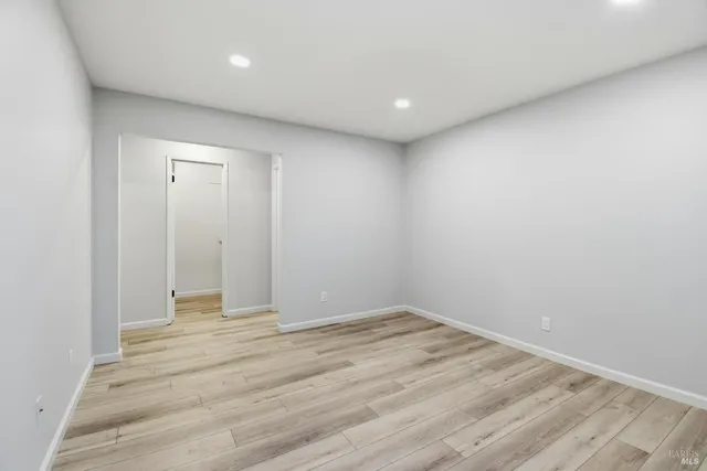 a view of room with wooden floor