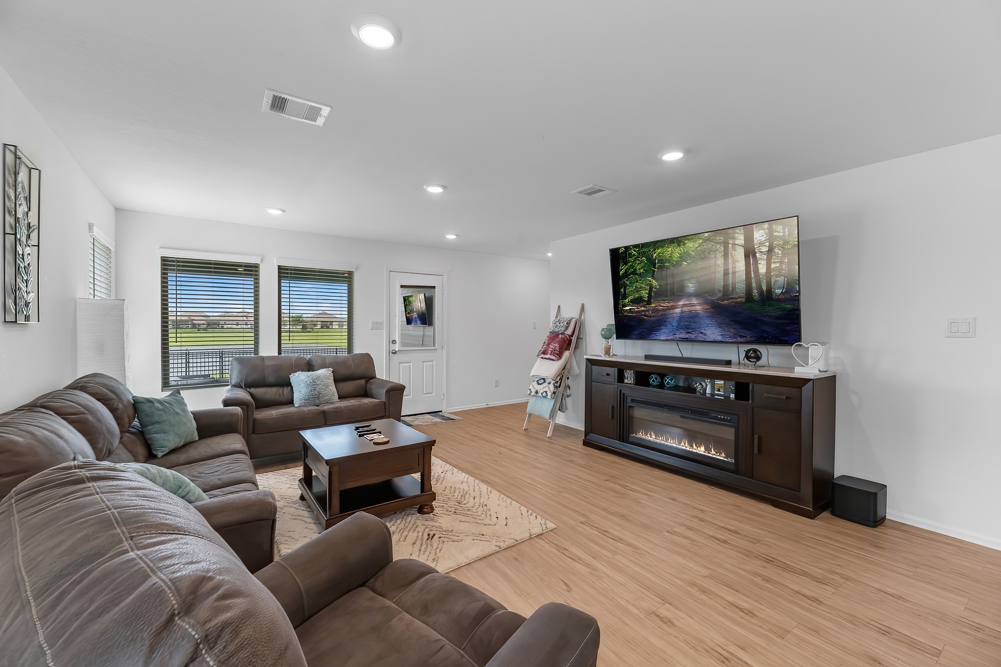 444 Maple Bend Lane La Marque, TX 77568 - Photo 11 of 32 a living room with furniture and a flat screen tv