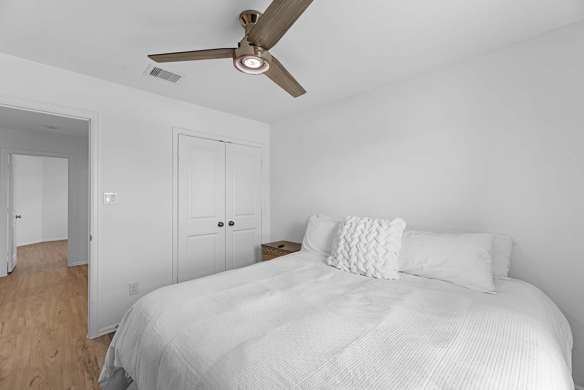 444 Maple Bend Lane La Marque, TX 77568 - Photo 16 of 32 a bedroom with a bed and a night stand