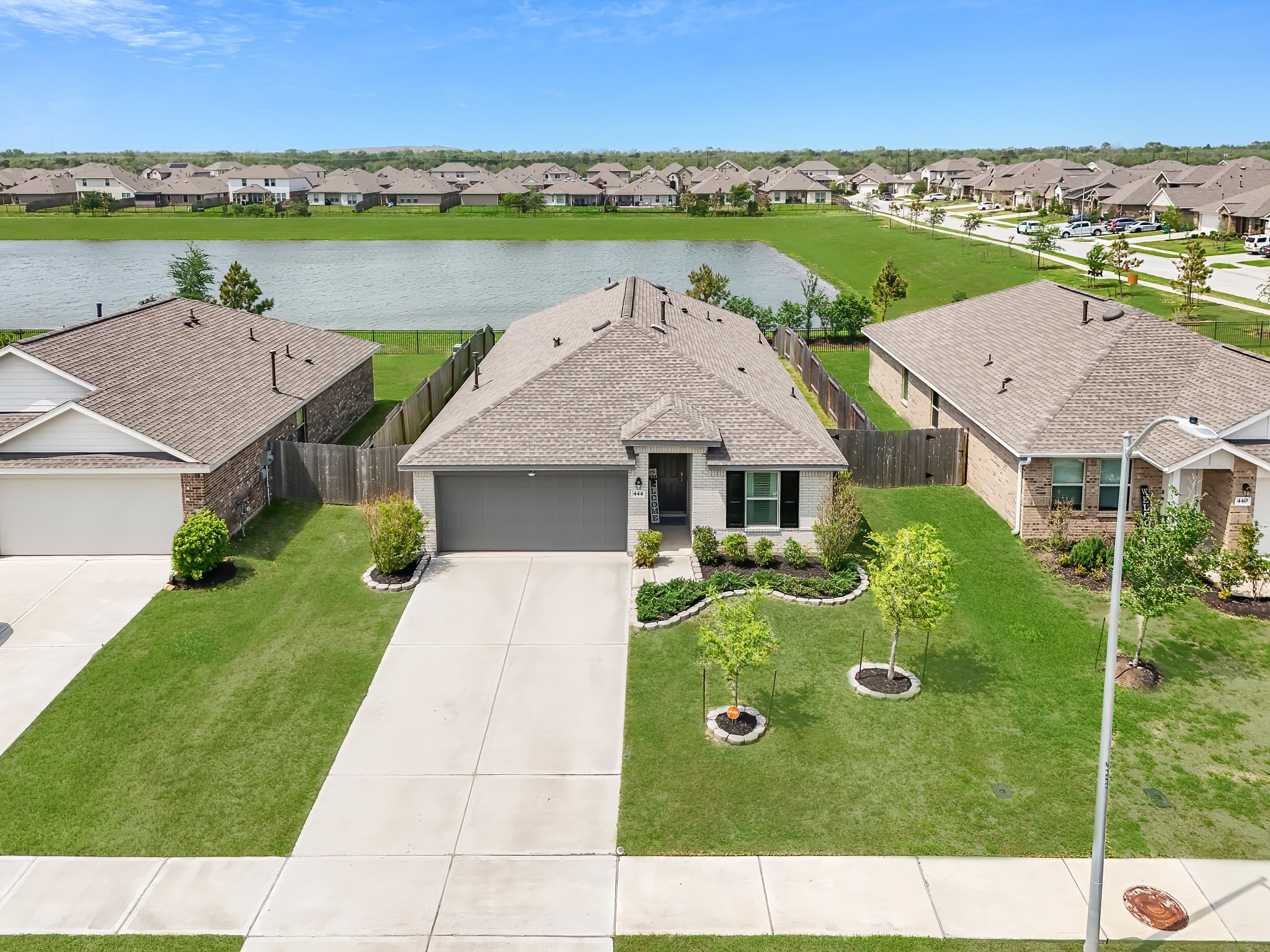 444 Maple Bend Lane La Marque, TX 77568 - Photo 2 of 32 an aerial view of a house with outdoor space and lake view