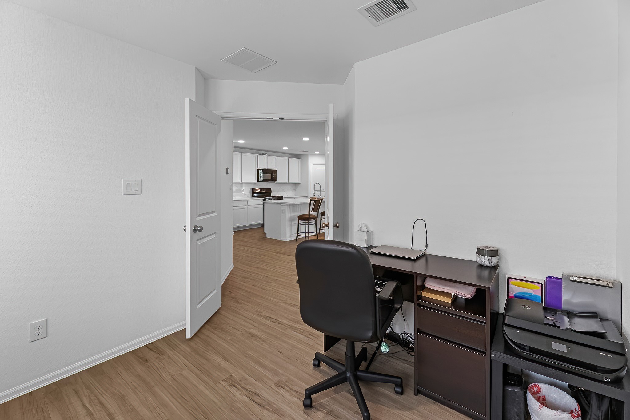 444 Maple Bend Lane La Marque, TX 77568 - Photo 22 of 32 a view of a workspace with furniture and wooden floor
