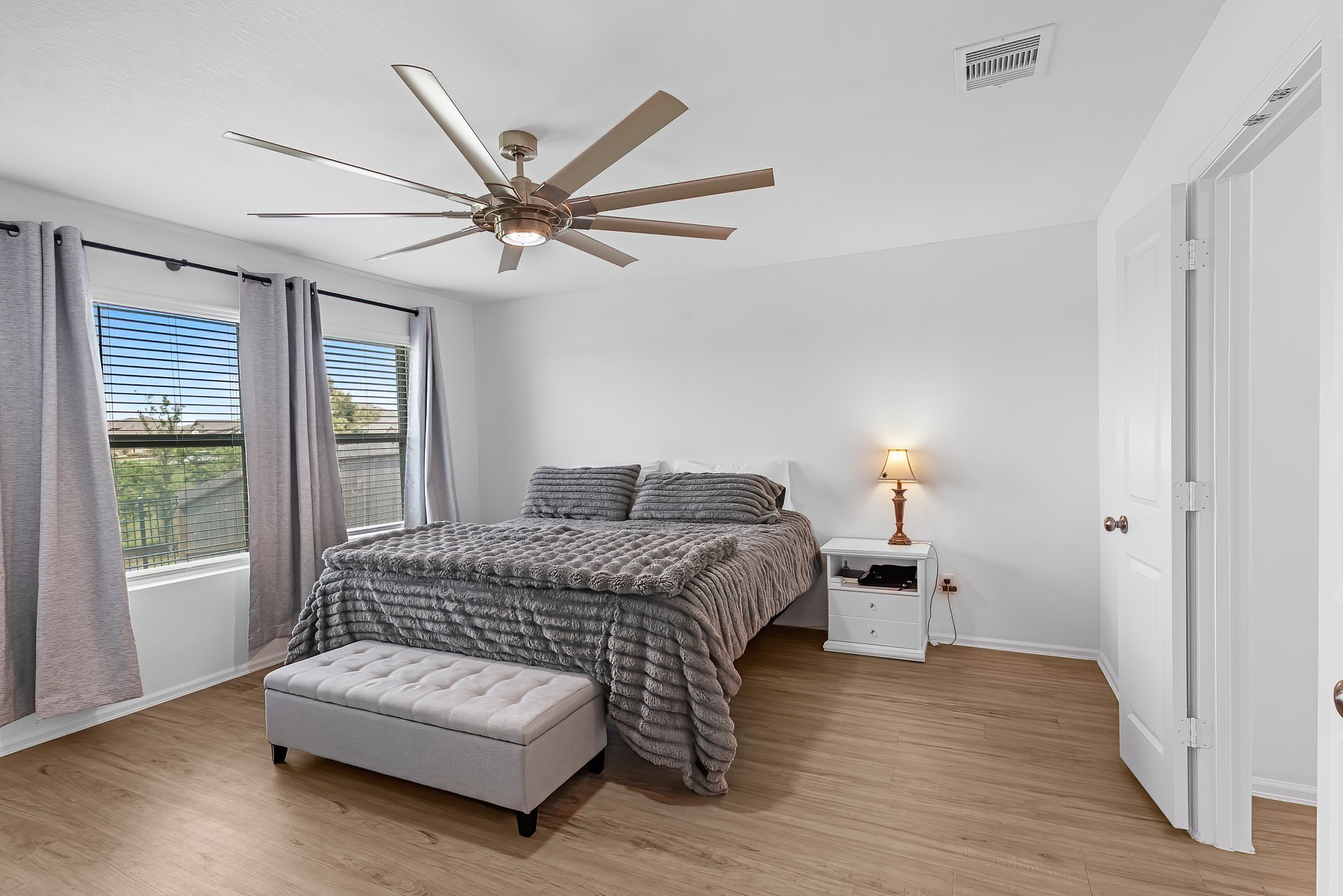 444 Maple Bend Lane La Marque, TX 77568 - Photo 23 of 32 a living room with a bed furniture and a window