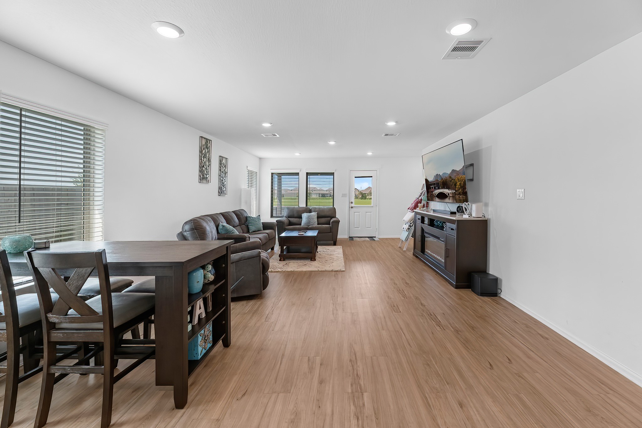 444 Maple Bend Lane La Marque, TX 77568 - Photo 10 of 32 a view of a dining room with furniture window and wooden floor
