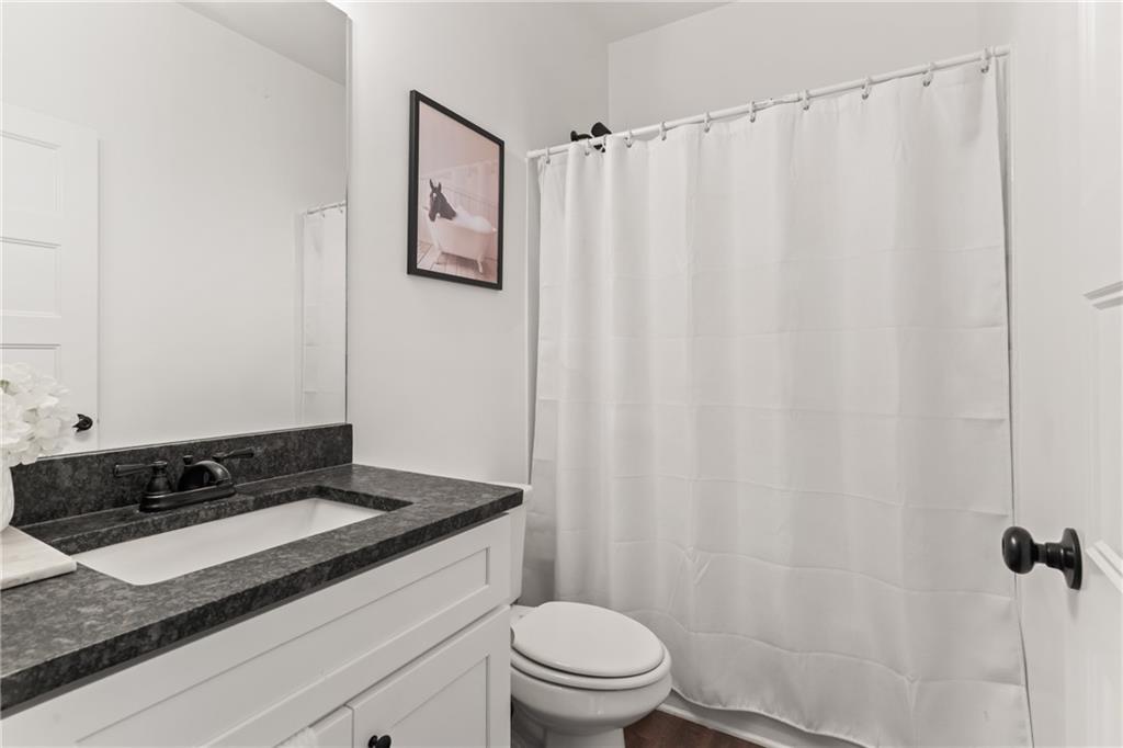 271 Moorings Run Jasper, GA 30143 - Photo 22 of 34 a bathroom with a granite countertop sink and a toilet