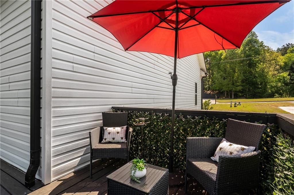 271 Moorings Run Jasper, GA 30143 - Photo 30 of 34 a view of a patio with a table and chairs under an umbrella