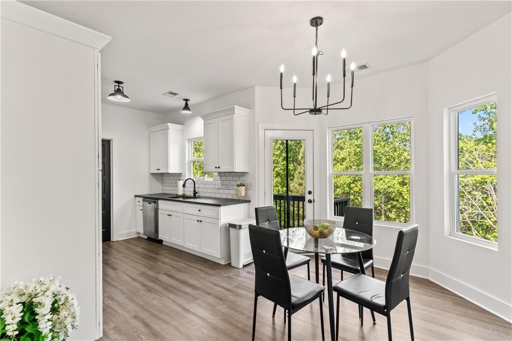 271 Moorings Run Jasper, GA 30143 - Photo 6 of 34 a kitchen with stainless steel appliances a dining table chairs and chandelier