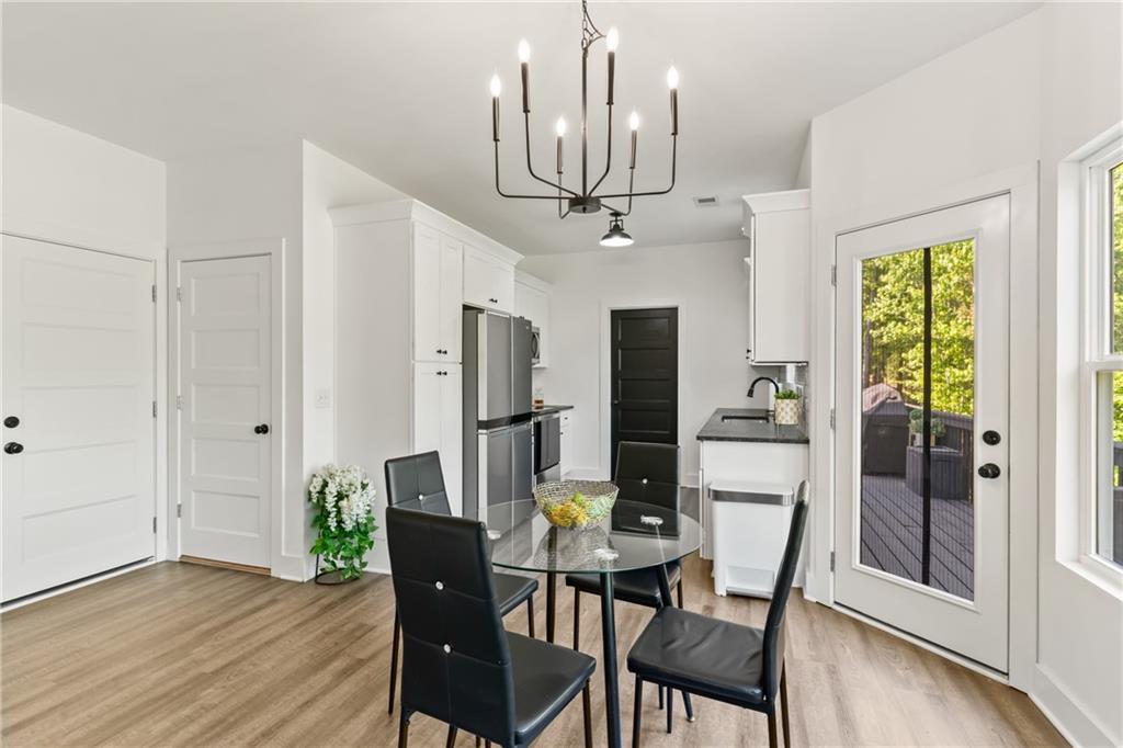 271 Moorings Run Jasper, GA 30143 - Photo 7 of 34 a view of a dining room with furniture window and wooden floor