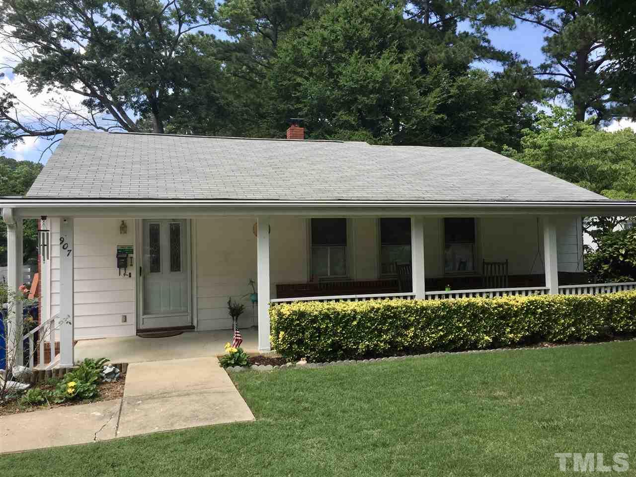 907 Mills Street Raleigh, NC 27608 - Photo 1 of 13 a front view of a house with a garden