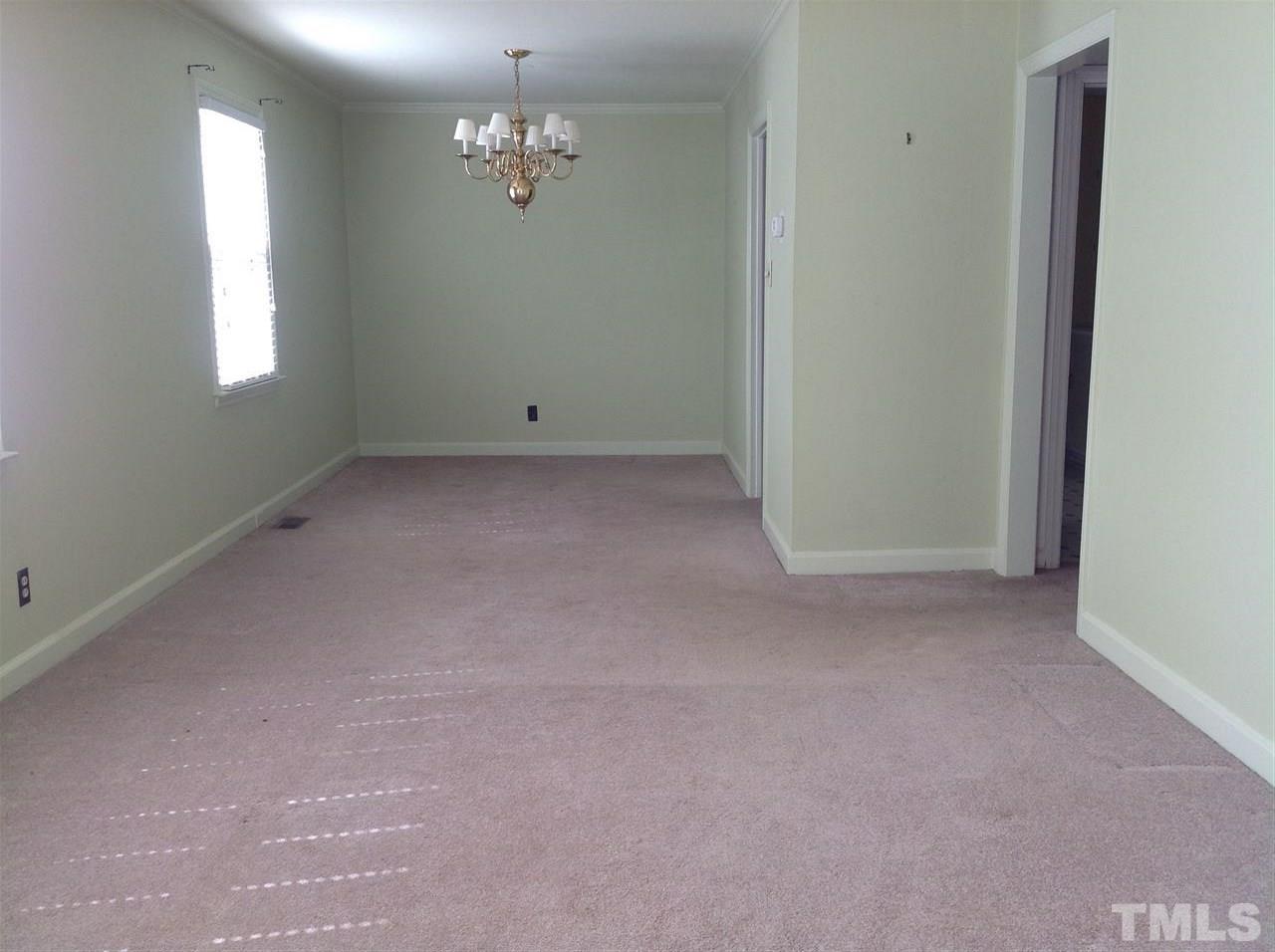 907 Mills Street Raleigh, NC 27608 - Photo 3 of 13 a view of empty room with chandelier