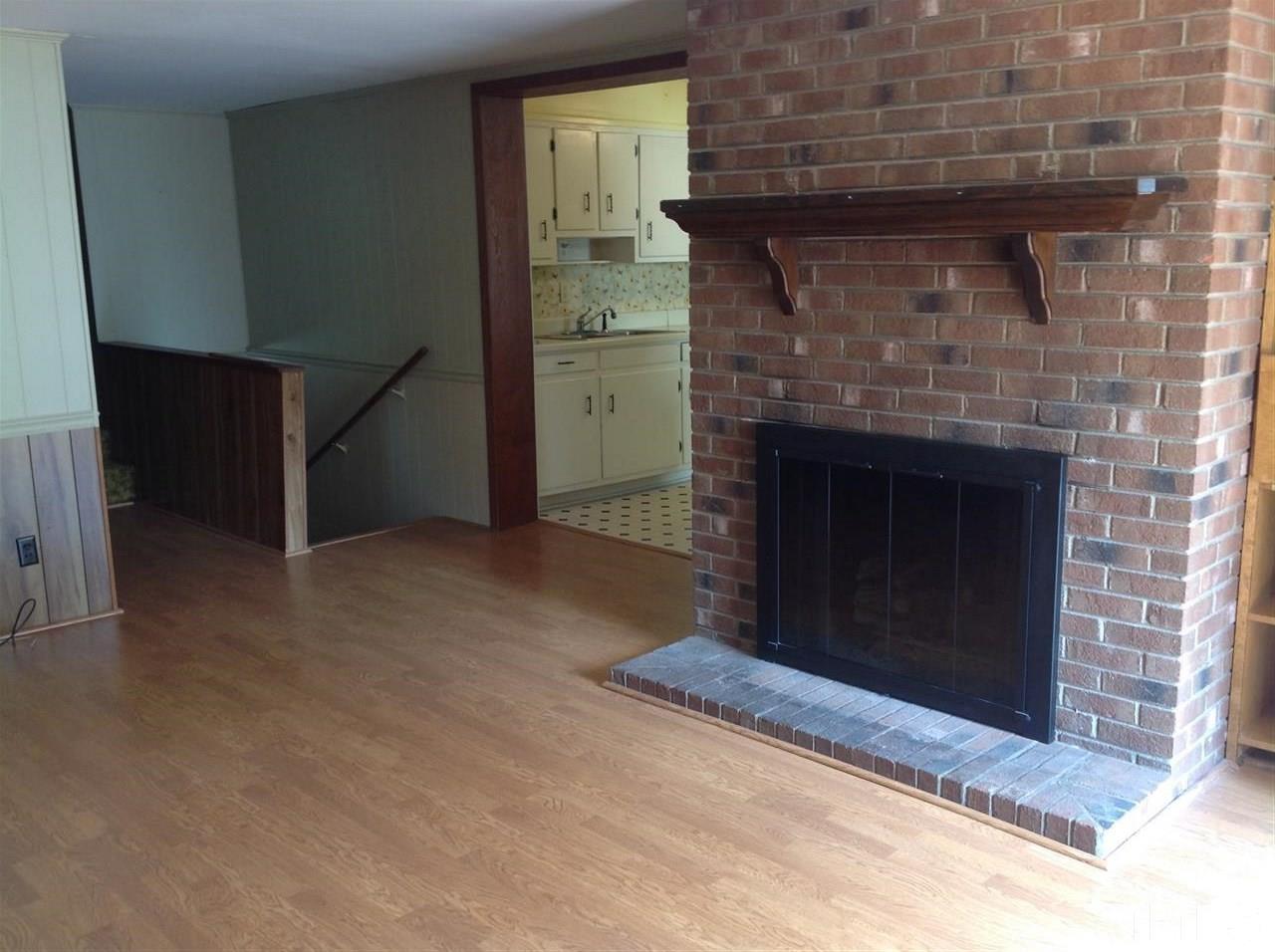 907 Mills Street Raleigh, NC 27608 - Photo 8 of 13 a living room with a fireplace