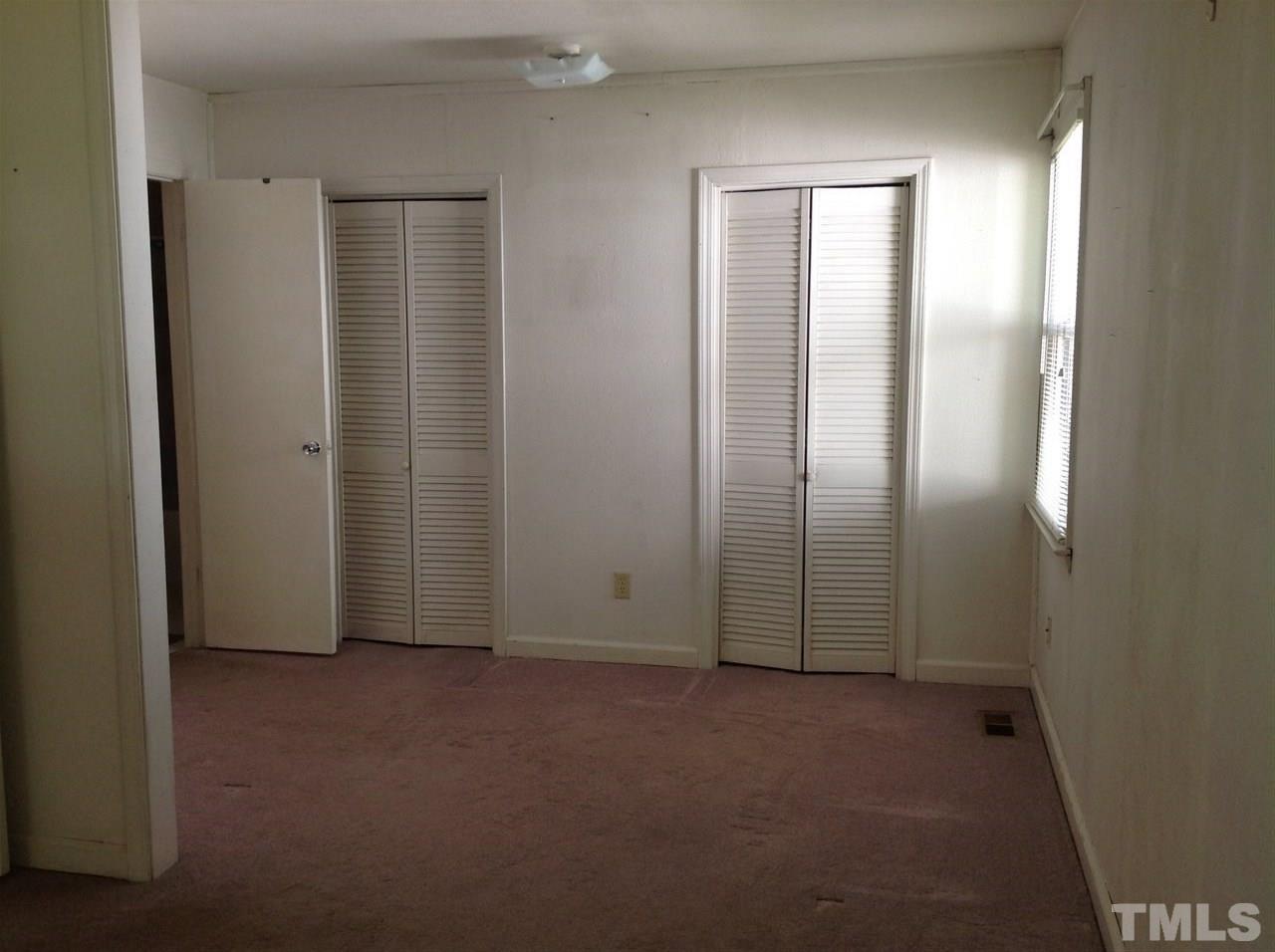 907 Mills Street Raleigh, NC 27608 - Photo 10 of 13 an empty room with windows